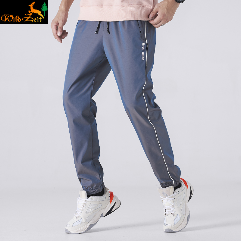 Outdoor soft shell flush pant pants men's spring autumn season windproof and waterproof and breathable elastic loose bundle foot sports casual pants man