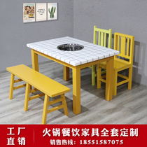 There is a hot pot table induction cooker integrated commercial small lattice smoke-free restaurant skewer incense market well dining table and chair combination