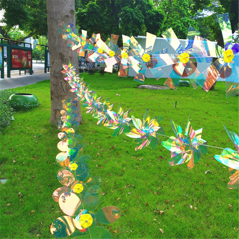 Fantasy color string windmill outdoor decoration hanging rotating kindergarten real estate decoration back light net red wind turning windmill string