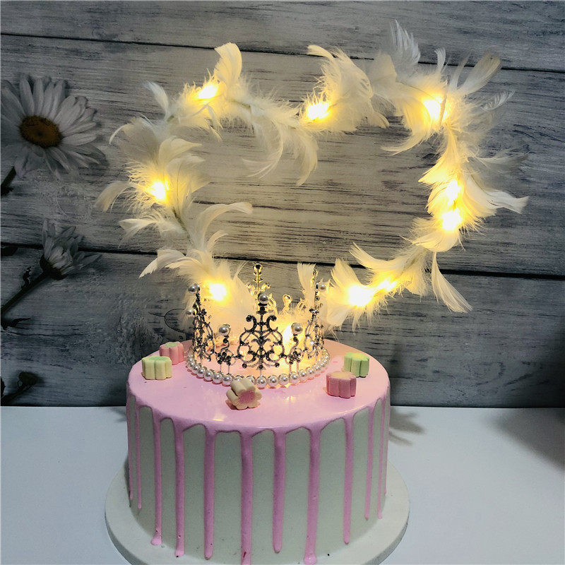 10 netted red feather wings cake decorated with love - hearted plug - in swan white