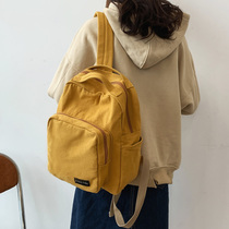 Schoolbag female Korean version of Harajuku ulzzang college students simple canvas backpack Japanese pendant small backpack ins wind