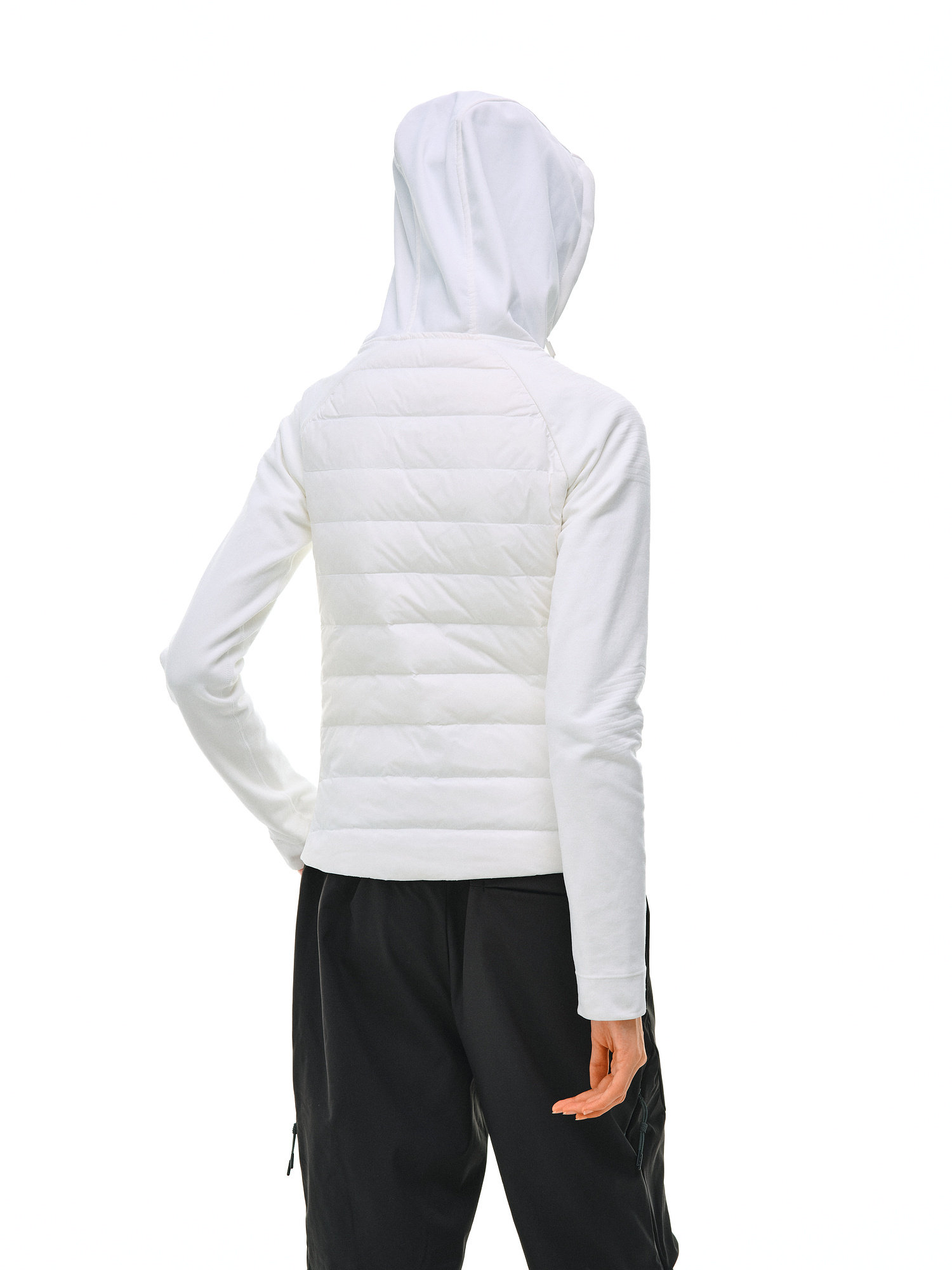 A person models the EastLyst Quilted Hooded Down Jacket in white, paired with black pants, standing against a plain white background to highlight its lightweight warmth.