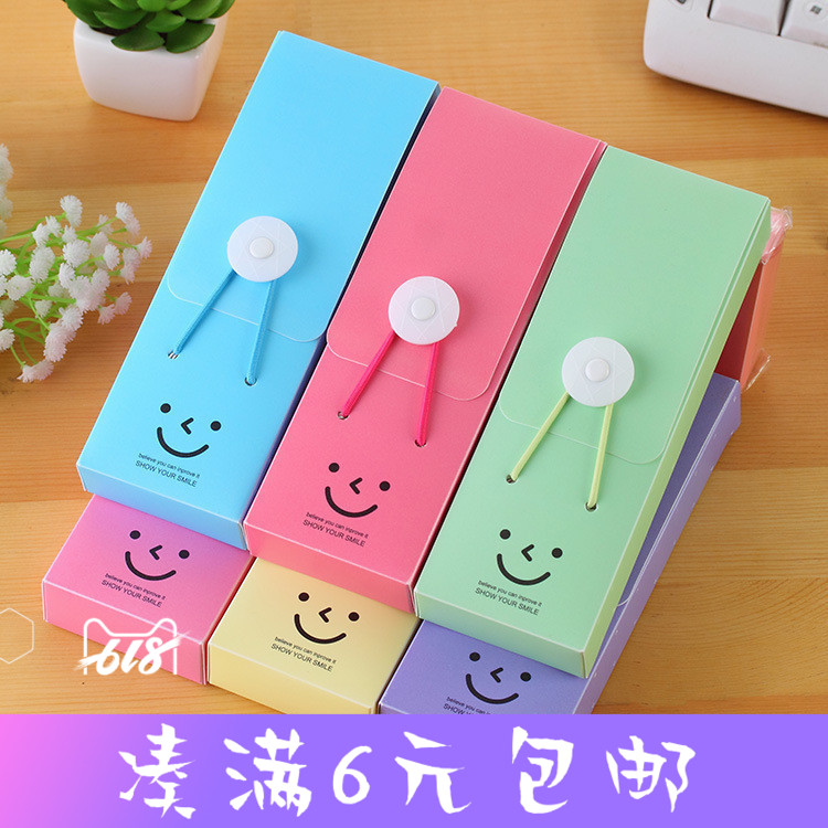 Japanese and Korean stationery smiling face elastic belt pencil case student creative storage box solid color cute cartoon smiling face pen case