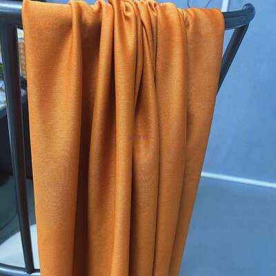 The fabric for the wedding background decoration in autumn and winter is orange, warm yellow, coffee-colored, caramel khaki, and purple soft elastic fabric
