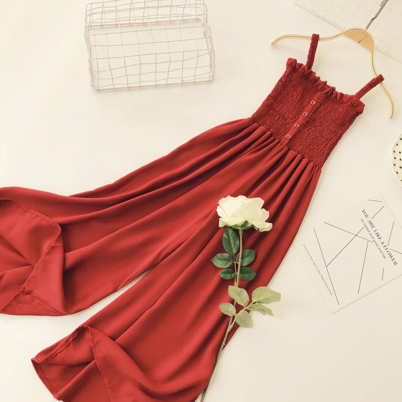Váy dài bãi biển hè 2018 mới xếp li ống tai bằng gỗ trang trí nút cao eo thon cao chân rộng quai jumpsuit váy chiết eo cao	