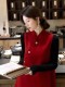 Estilo digno y elegante mejorado nuevo estilo chino rojo cuello alto chaleco con solapa inclinada para mujer otoño e invierno nuevo dobladillo inclinado top de Año Nuevo