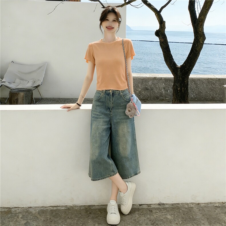 设计感小众时尚运动休闲套装女夏新款圆领背镂空短袖牛仔裤两件套图片