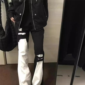 美式高街风裤子黑白拼接破洞牛仔裤男款修身百搭显瘦微喇长裤图片