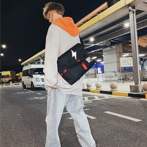 0753新款背包撞色闪电休闲情侣潮酷牛津布单肩斜挎包斜跨背包图片