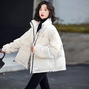 主打款羽绒服白鸭绒90绒冬夜光亮面宇航员太空人外套情侣款图片