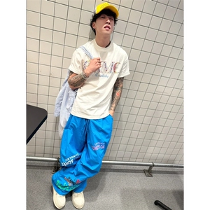 美式垂感夏日多巴胺裤子女款五一出游出片穿搭涂鸦阔腿伞兵工装裤图片