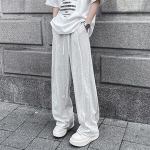 美式解构伐木裤春夏潮牌小众设计感弯刀卫裤男女直筒休闲裤子图片