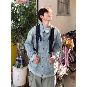 蓝色纽扣牛仔夹克春秋季男生2025新款翻领宽松休闲上衣外套口袋图片