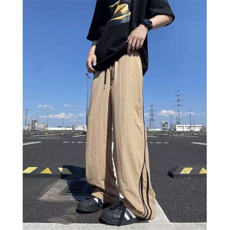 美式条纹裤子男生夏季薄款激光打孔设计潮牌大码宽松直筒运动长裤图片