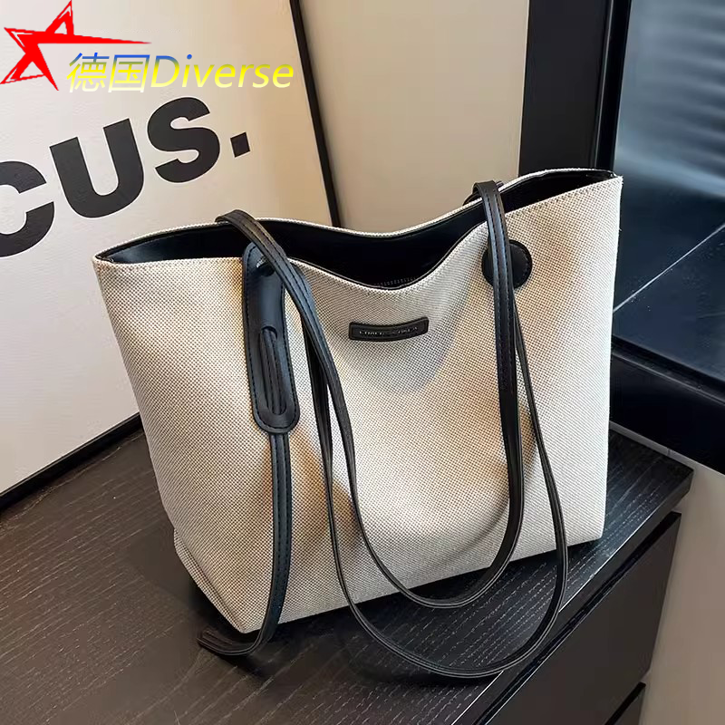 German Diverse High-End Women's Niche Design Canvas Bag, Fashionable Large-Capacity Work and Commuting Tote Bag German Diverse High-End Women's Niche Design Canvas Bag, Fashionable Large-Capacity Work and Commuting Tote Bag