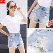 Mùa hè mới lỗ phá quần short denim nữ loose-fitting rộng chân 2020 sinh viên Hàn Quốc phiên bản của xu hướng thắt lưng cao cho thấy chiếc váy mỏng