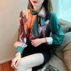 Mulberry silk printed streamer shirt is beautiful and fashionable with a skirt. Chic high-end shirt