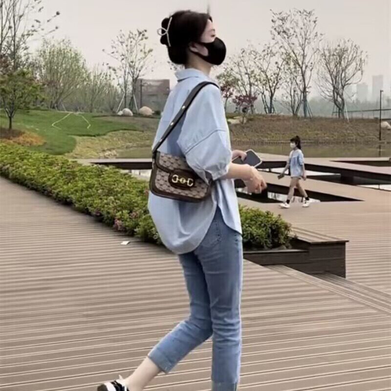 The 2025 new style of women's summer shirt with a hollowed-out back and loose pleated top