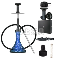 Полупрозрачная бутылочка синего цвета с рисунком.