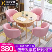 Sales office in talks with table and chairs combined light extravaganza minimalist modern reception Nordic small round table guests casual table and chairs
