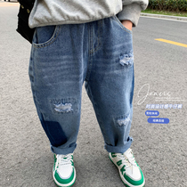 Boy jeans spring autumn 2022 new children Korean version Broken Hole Pants Middle Boy Boy Fashion Old Daddy Pants Tide