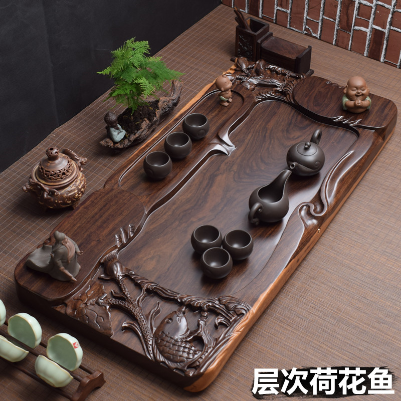 Ebony tea tray whole piece of solid wood thickened fine carving Large household log tea sea tea table draining Kung Fu tea set