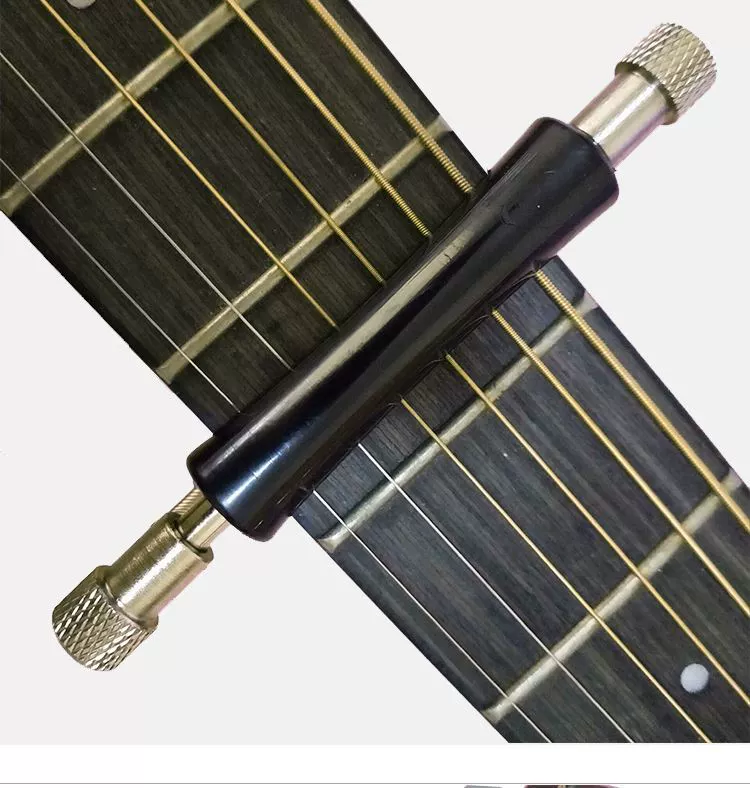 Vibrato sinh viên acoustic guitar nhạc cụ guitar túi trang trí tạo tác thiết bị phụ trợ cung cấp nhãn dán duy nhất guitar capo - Phụ kiện nhạc cụ