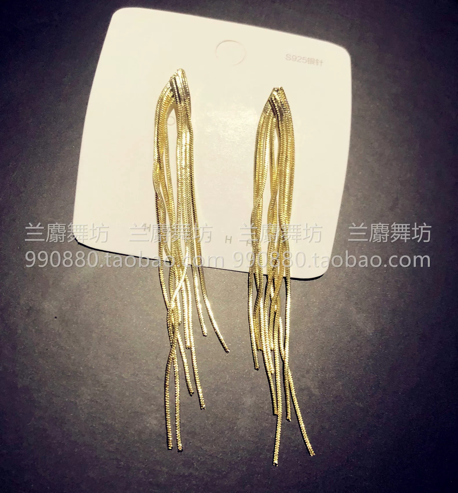Golden earrings with tassels