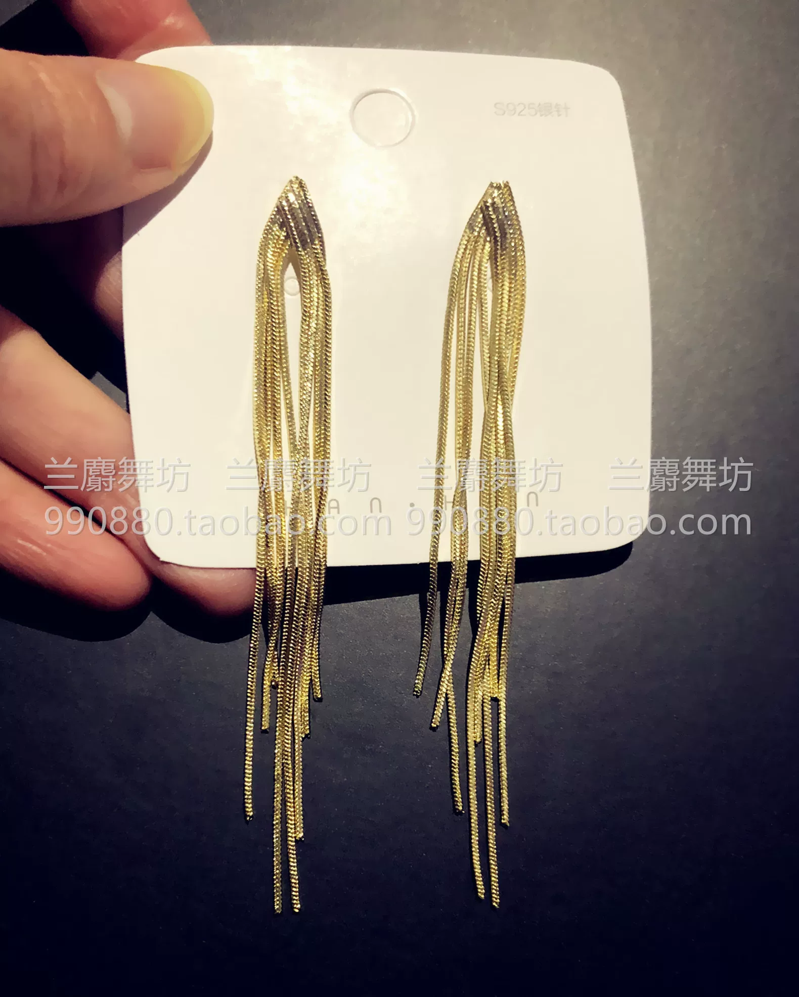 Golden earrings with tassels