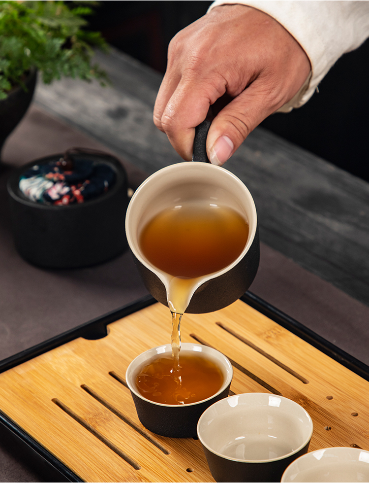 Black pottery travel kung fu tea set to crack a pot of four cups of portable BaoHu outside Japanese household custom logo