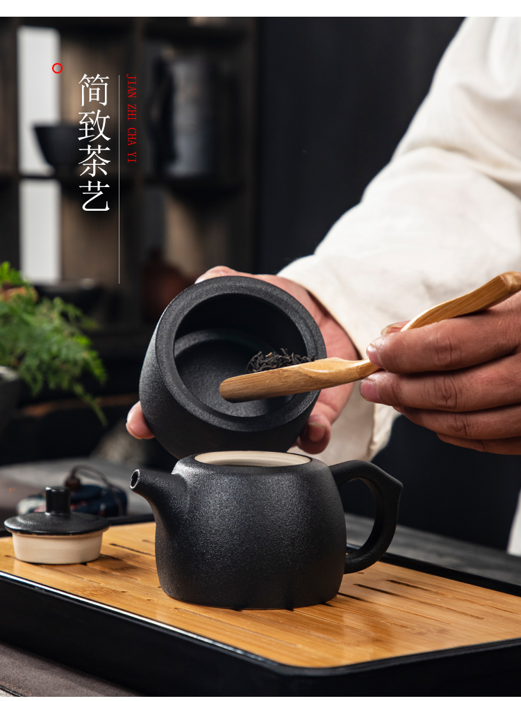 Black pottery travel kung fu tea set to crack a pot of four cups of portable BaoHu outside Japanese household custom logo