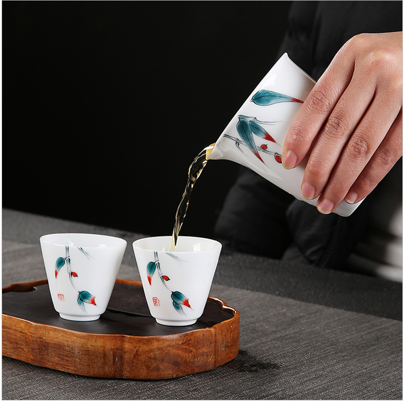 Dehua white porcelain kung fu tea set suit household hand - made tureen tea teapot tea cups of a complete set of suits for