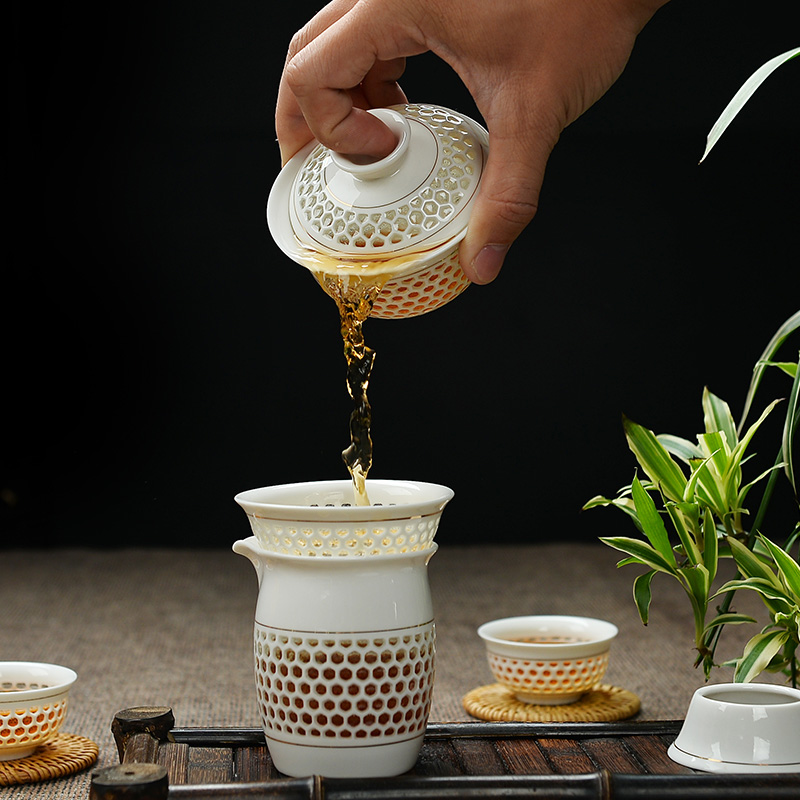 To the as porcelain and white porcelain kung fu tea set suit household contracted hollow honeycomb porcelain cups and exquisite tureen clearance