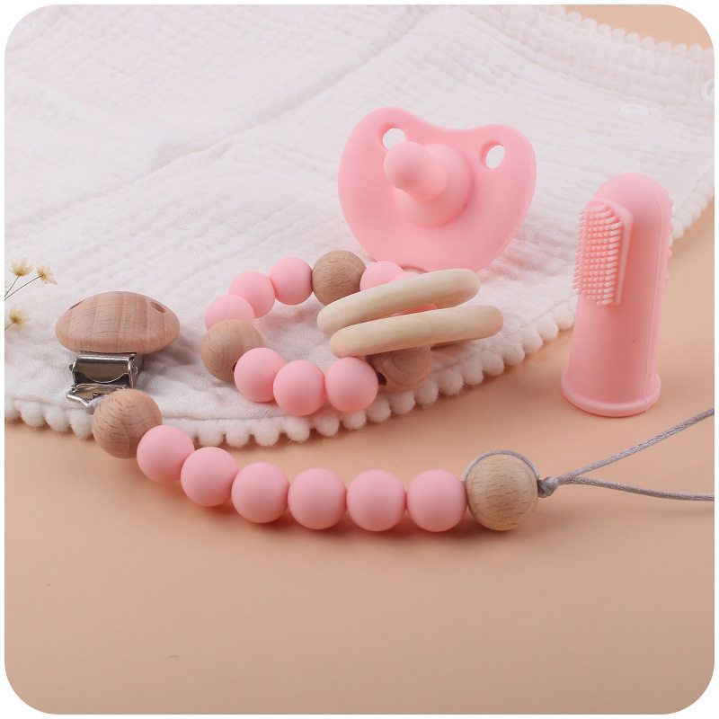 New infant products silicone four-piece set to calm baby silicone pacifier fingertips fingerbrush tissue chain