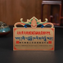 Painted bronze medal over the door