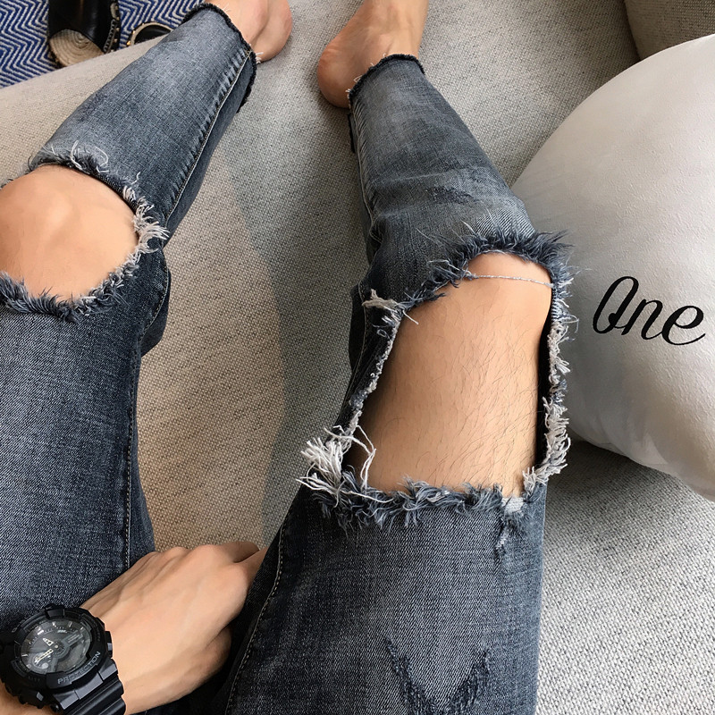 Attitude This year's popular high street knee hole jeans ins net red Korean version of nine-point pants men's trend pants