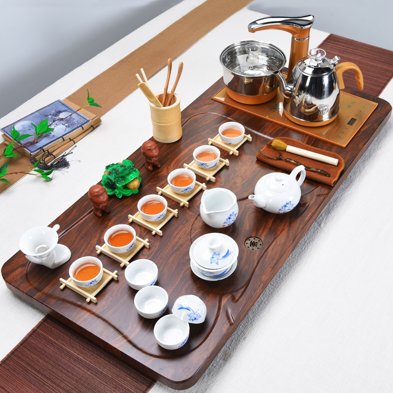 Violet arenaceous kung fu tea set solid wood tea tray of a complete set of household contracted suit electromagnetic heat furnace automatic four unity