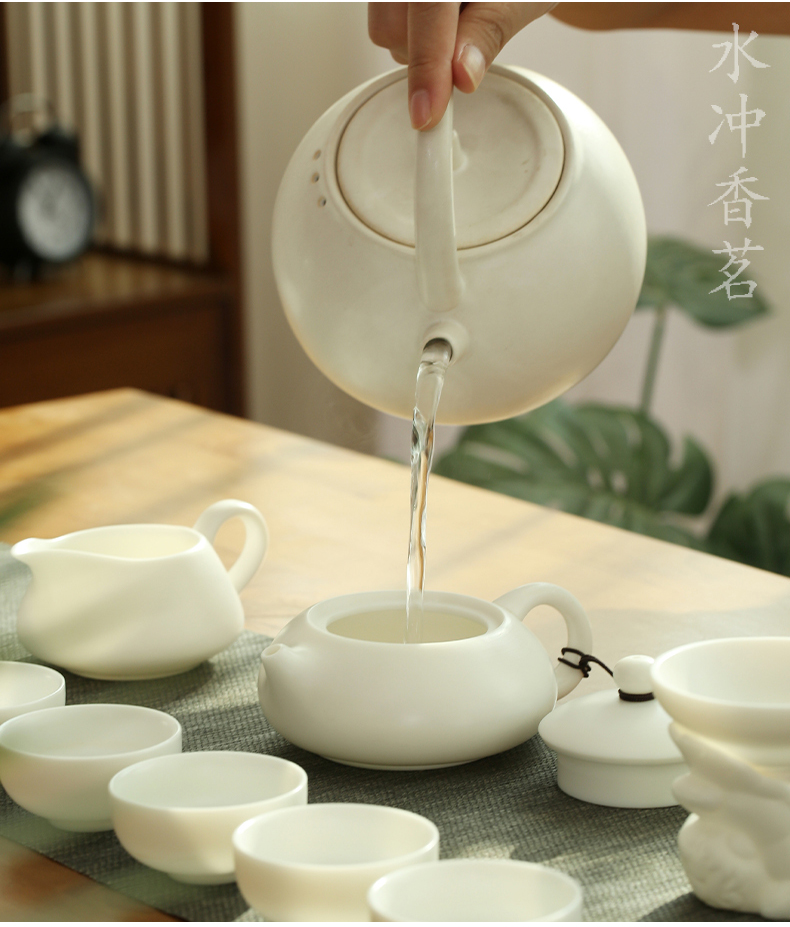 Dehua suet jade biscuit firing manual white porcelain kung fu tea set suit household ceramic teapot of a complete set of tea cups