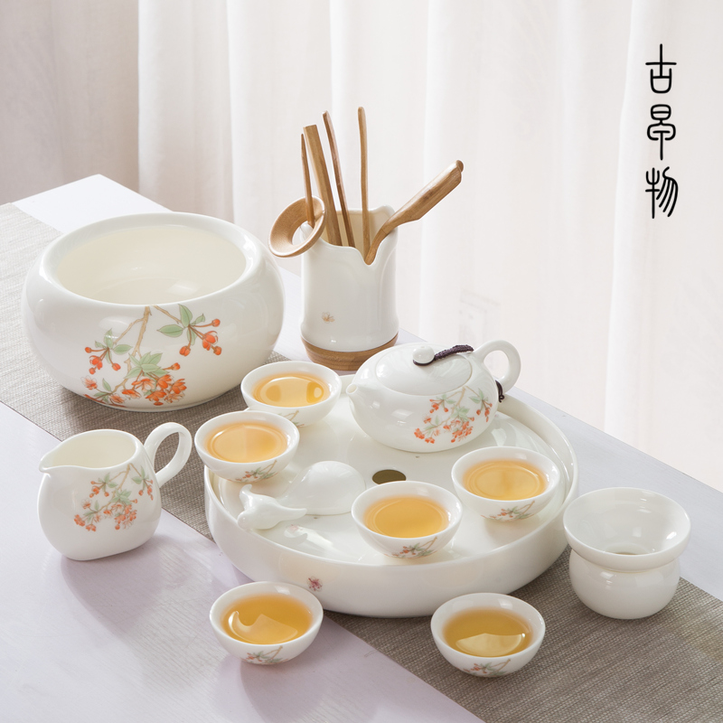 A complete set of dehua white porcelain suet jade suit household green kung fu tea set ceramic tea tray was contracted tea table