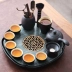 Bàn trà bằng đá tự nhiên gốm loại lưu trữ nước nhỏ Đá Wujin hiện đại nhỏ gọn văn phòng tại nhà khay trà kung fu bộ trà nĩa gỗ Tấm