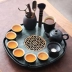 Bàn trà bằng đá tự nhiên gốm loại lưu trữ nước nhỏ Đá Wujin hiện đại nhỏ gọn văn phòng tại nhà khay trà kung fu bộ trà nĩa gỗ Tấm