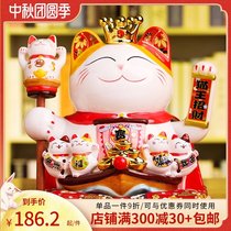 Zhen waving hand to attract wealth cat ornaments opening large and small shops cashier home living room gifts automatic beckoning