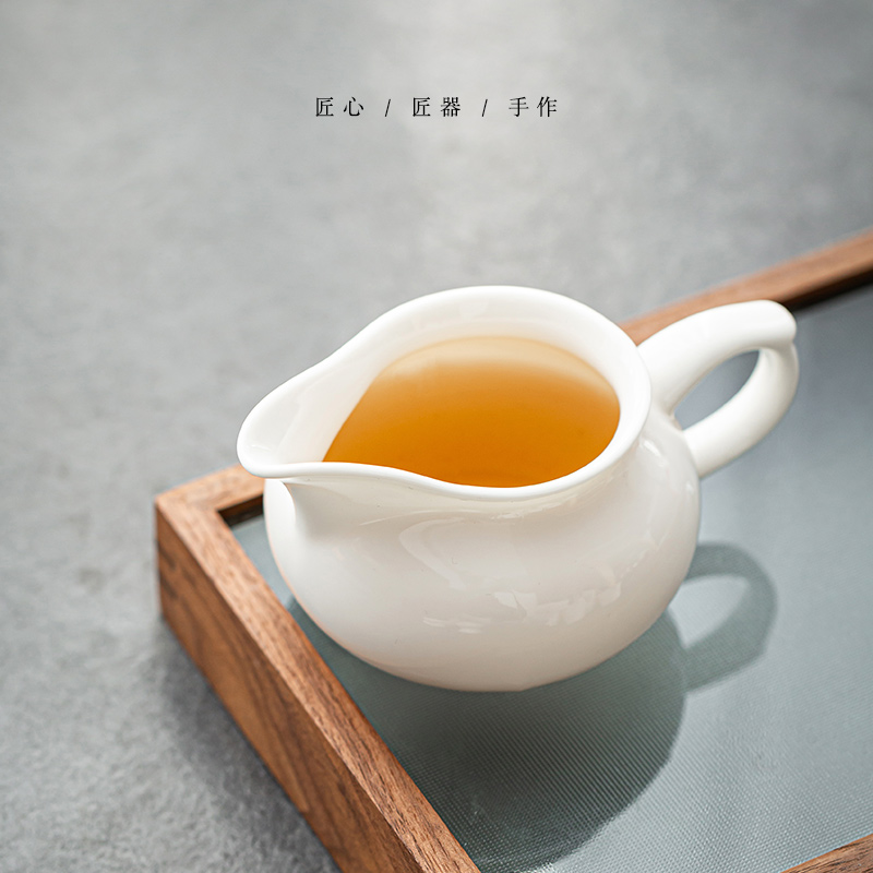 Ceramic appliance with fair keller make tea and a cup of tea is white jade porcelain filtering sea kung fu tea tea tea accessories