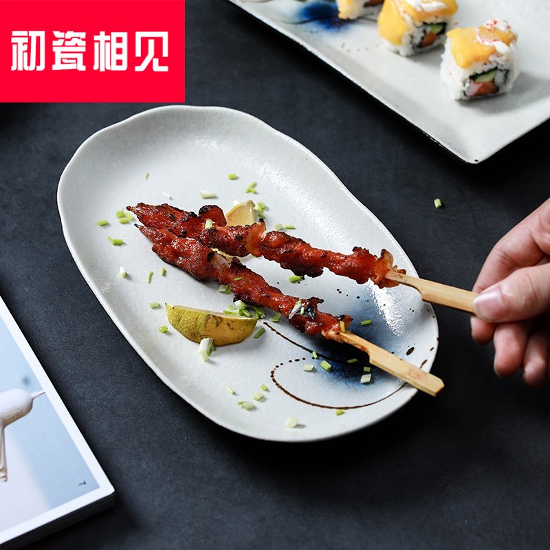 Porcelain meet each other at the beginning of the fish dish ceramic household large creative Japanese plate elliptical steamed fish dish under the glaze color A57