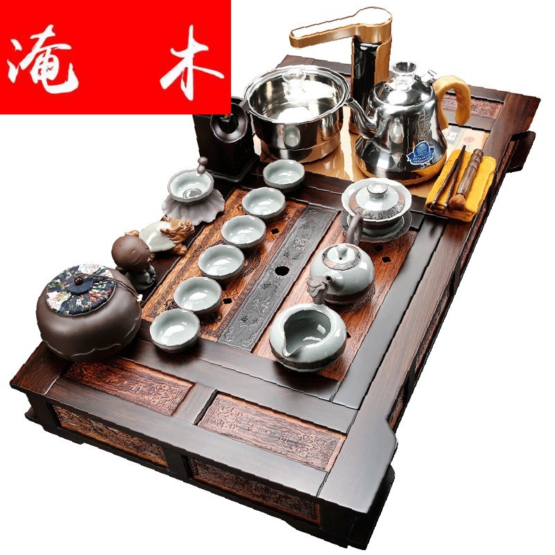 Flooded ebony wood tea tray was violet arenaceous kung fu tea set four unity of a complete set of automatic induction cooker household tea set