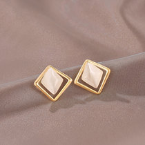 Autumn and winter Cats Eye Stone earrings female simple niche Korean temperament earrings 2021 New Tide design feel ear ornaments