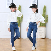 New 2021 girls jeans spring wear hole small foot pants childrens casual Joker Korean slim long pants tide