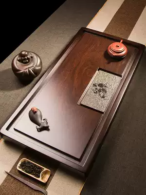 Natural whole black sandalwood tea tray solid wood tea table household drainage kung fu tea tray living room black stone Tea Sea