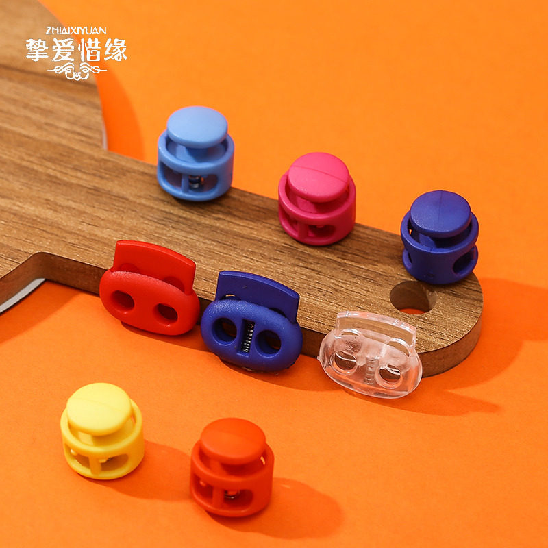 Button button Tightening spring elastic adjustment button Color plastic hanging bell rope fixed wear pig's nose card stop rope button