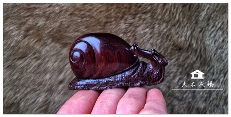 Hainan's yellow flower pear purple oil pear wood stock to play a piece of hands to play a snail in peace and contentment with a male high-end red wood